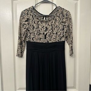 Evening gown, gently used, slight fraying on bottom of dress from wear.